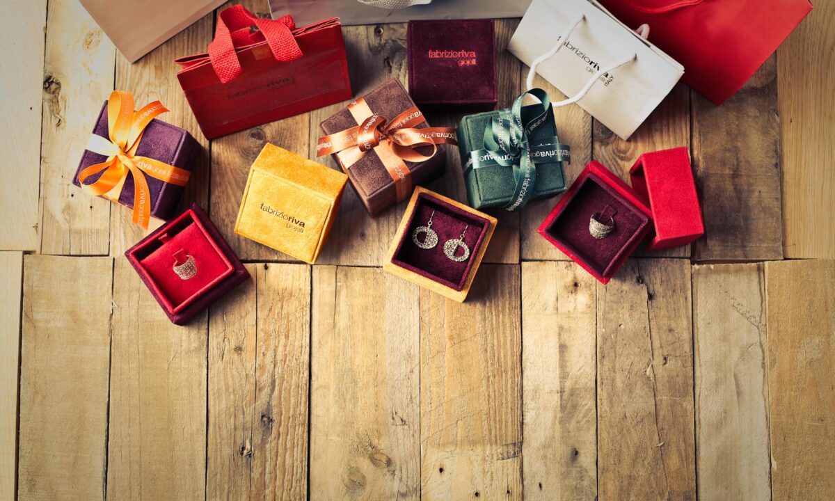 assorted gift boxes on brown wooden floor surface