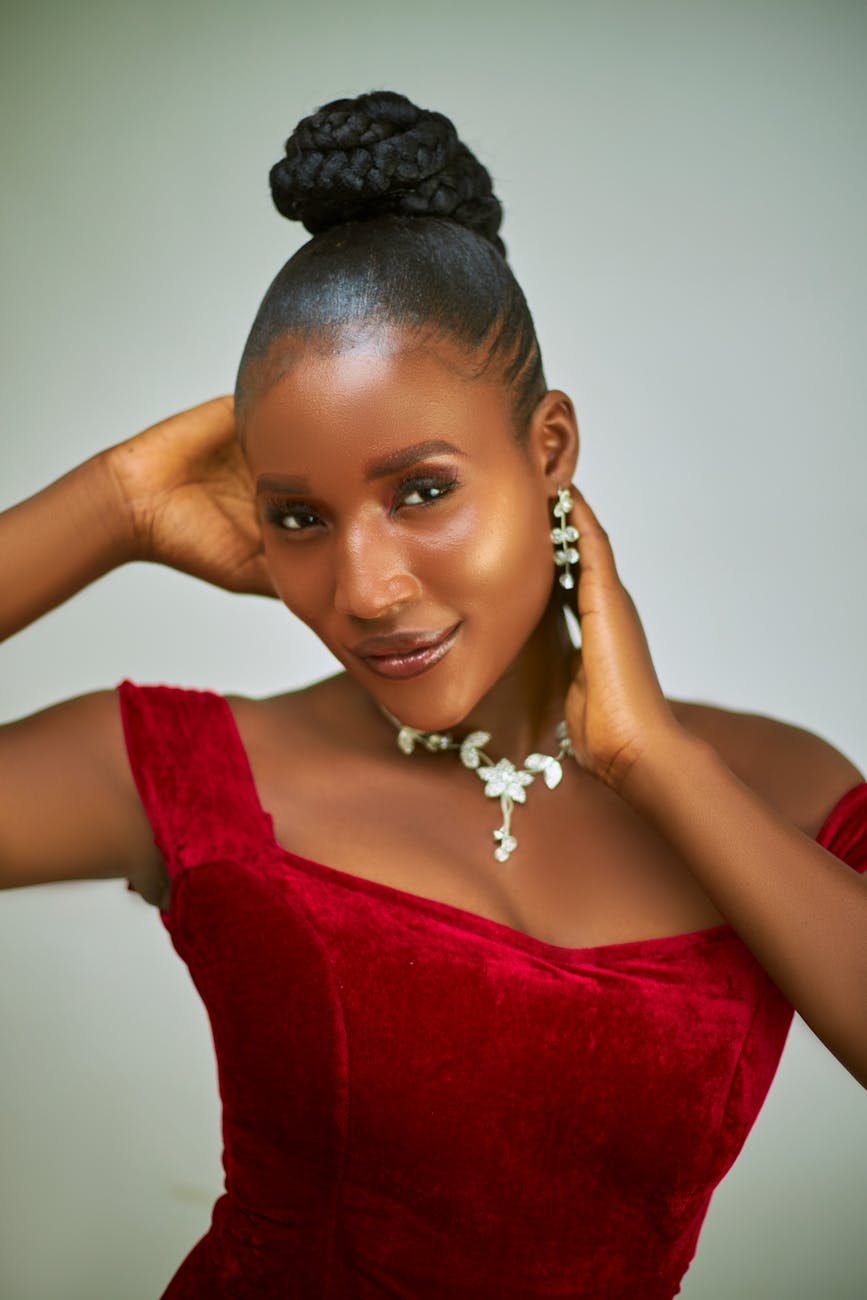 elegant woman posing in red velvet dress