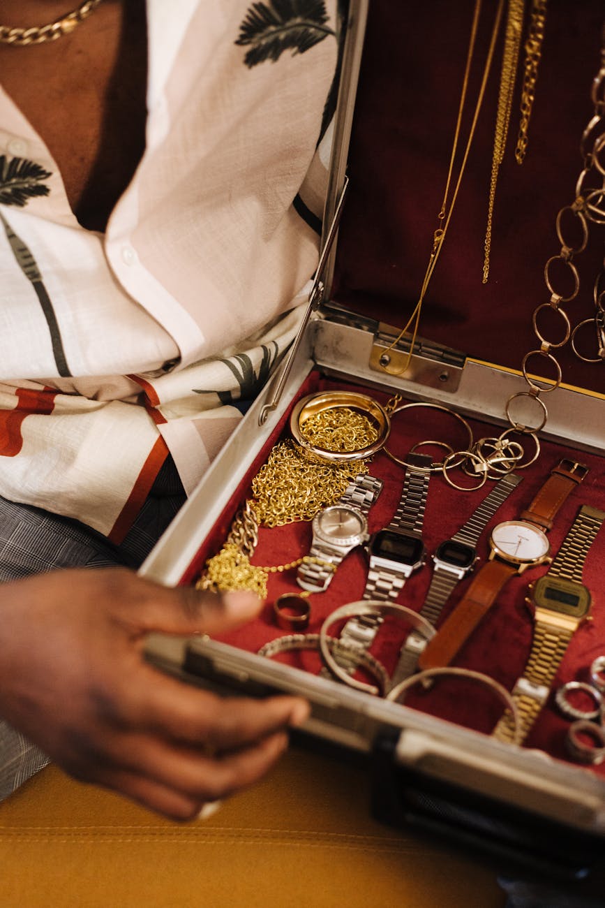 a person holding a briefcase with jewelries