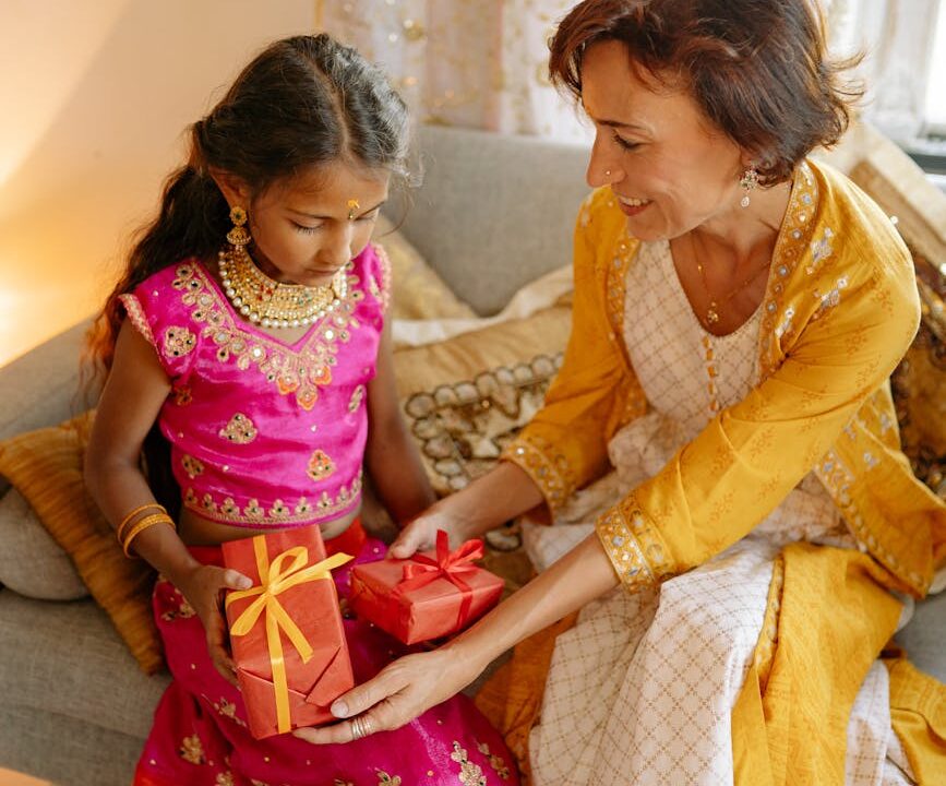 girl in traditional dress receiving gifts